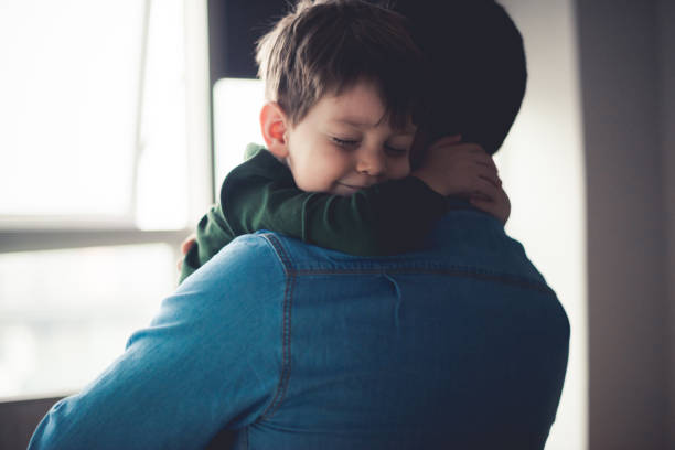 Baby hugging parent