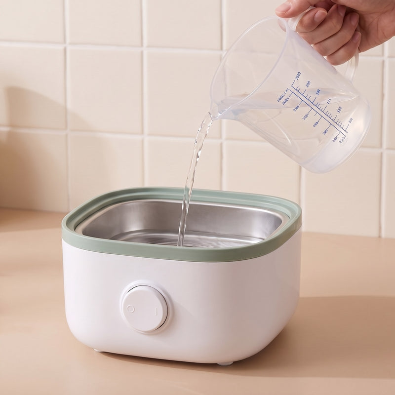 Giet 75 mL water in de basis